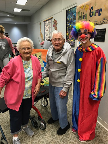 Helen and Dale Lippencott pose with clown